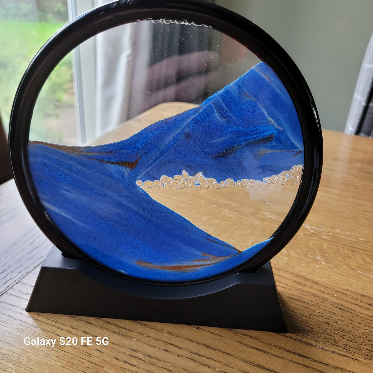 Moving sand art